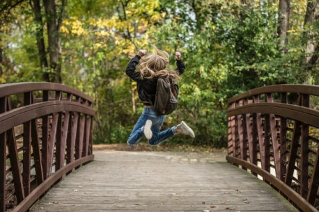 Character Strengths girl jumping on bridge